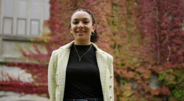 This is an image of a student standing in the campus.