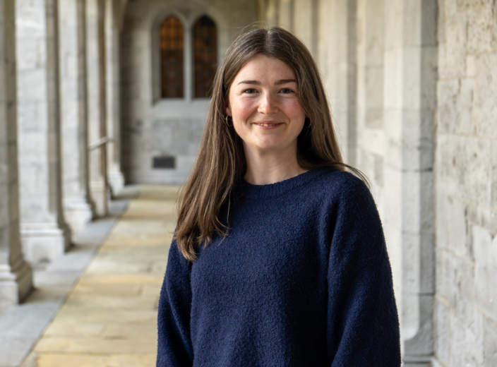 Saoirse posing for a picture in the quadrangle