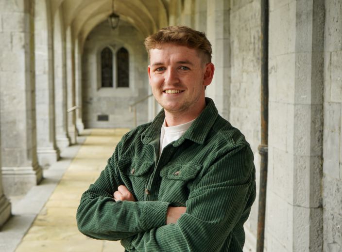 Tadhg posing for picture in quad