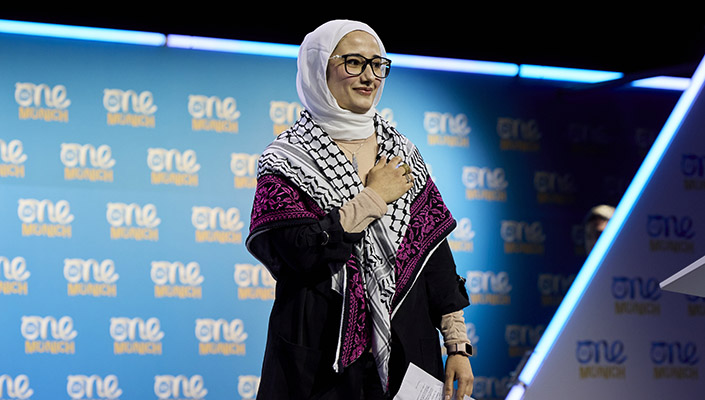 Shirene Yaseen receives a standing ovation after addressing delegates at the One Young World Summit 
