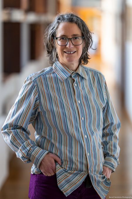 Catherine Emerson posing with glasses and shirt