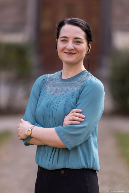 Melissa Bastian outdoors standing with arms folded