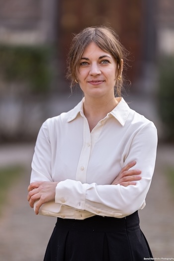 Eva-Lotte Gebhardt posed with white shirt and folded arms