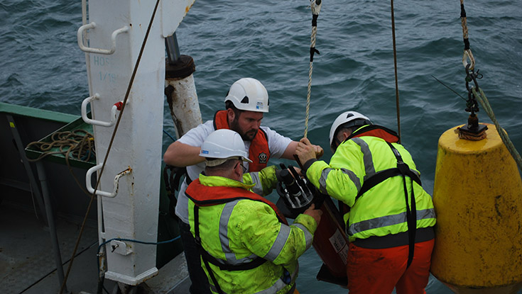 NUI Galway PhD researcher Eoghan Daly (centre) with crew members Paddy Byrne and Stephen Lantry (lef