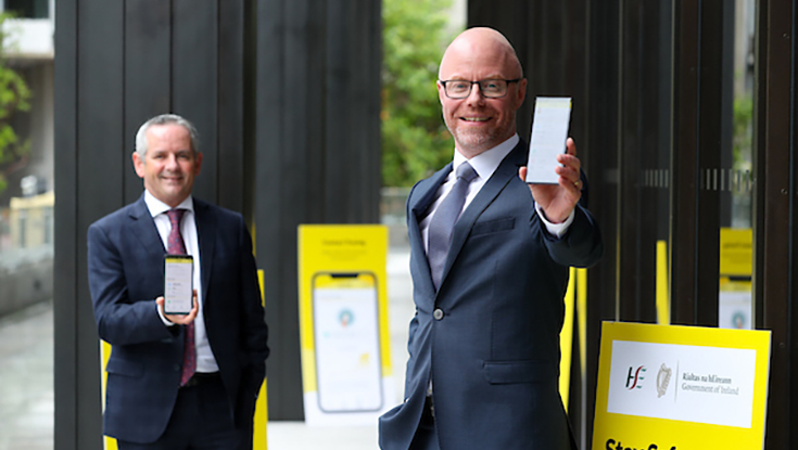 Health Minister Stephen Donnelly and HSE Director General Paul Reid using the Covid Tracker App