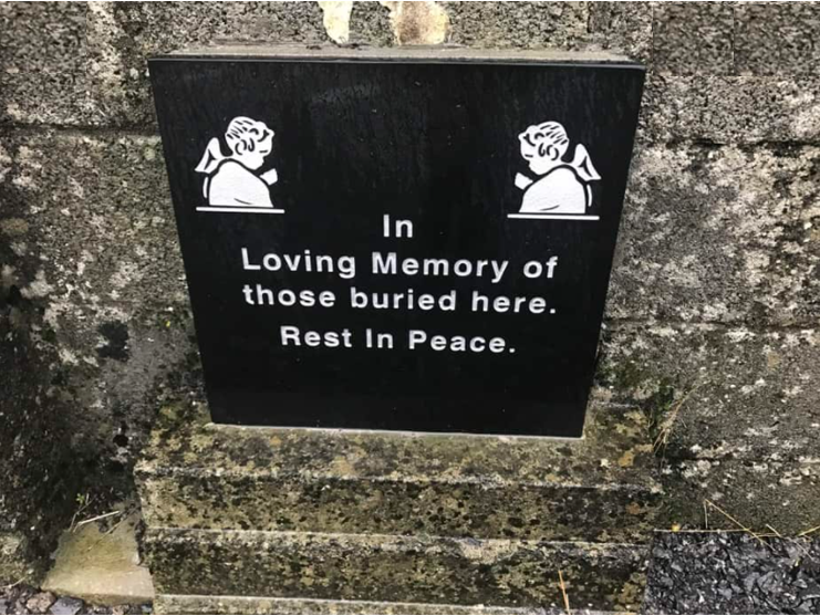 Children’s socks hang at a shrine in Tuam, County Galway