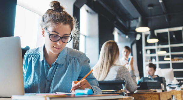 female studet sitting at desk in study space