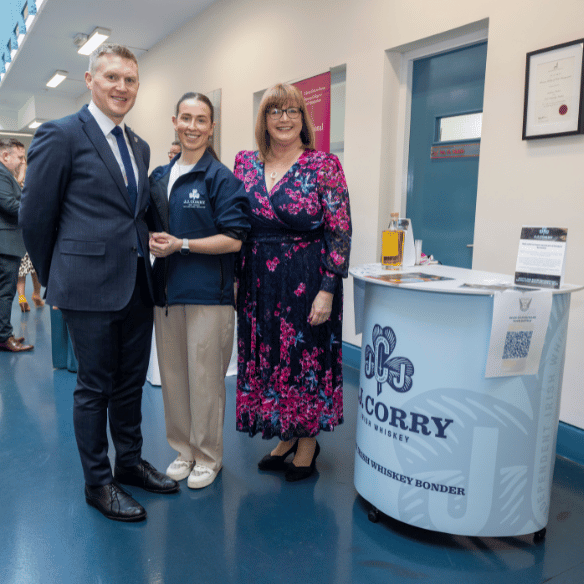 deputy head of college and head of placements pictured with JJ Corry representative and stand.